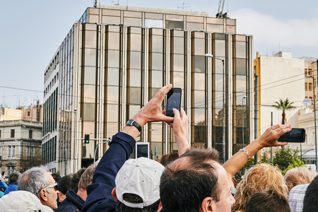 Athens, Greece - March 27, 2016: Crowd admiring and photographing the changing of the honor Evzones guards ceremony in front of  the Tomb of the Unknown Soldier at the Parliament Building in Syntagma Square, Athens, Greece.のeditorial素材