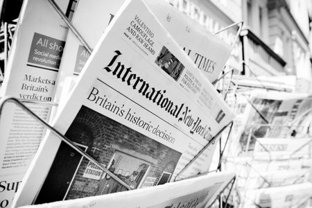 STRASBOURG, FRANCE - JUN 24, 2016: International New York Times and other major newspapers headline titles at press kiosk about the Brexit referendum in United Kingdom which has decidedthe country wishes to quit the European Unionのeditorial素材