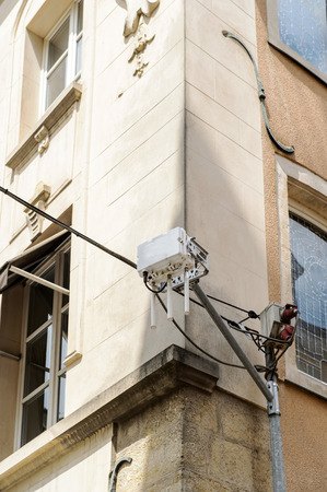WiFi router on building corner for free internet service in a modern cityの写真素材