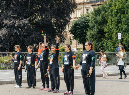 STRASBOURG, FRANCE - JUN 25: Members of Turkey's Alevi community protesting denouncing the evolution of the political situation in Turkey - girls with PEACE t-shirt andのeditorial素材