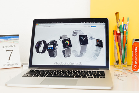 PARIS, FRANCE - SEP 8, 2016: Apple Computers website on MacBook Pro Retina in a geek creative room environment showcasing introducing Apple Watch Series 2のeditorial素材