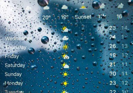 PARIS, FRANCE - SEP 26, 2016: New Apple iPhone 7 Plus unboxing and testing - weather app on iPhone screen with forecast. New iPhone7 is one of the best waterproof smart phone in the worldのeditorial素材