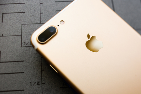 PARIS, FRANCE - SEP 26, 2016: New Apple iPhone 7 Plus unboxing and testing - rose gold phone with double camera. New iPhone7 is one of the best waterproof smart phone in the worldのeditorial素材