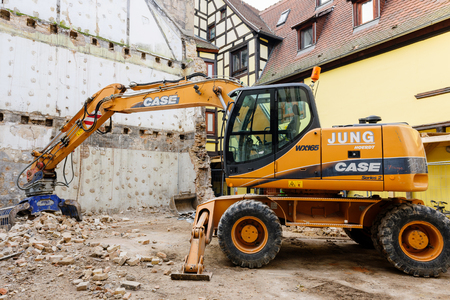 STRASBOURG, FRANCe - CIRCA 2015: Standard rock mass excavator with bucket mining showel steel teethes of a new Case caterpillar industrial excavatorのeditorial素材