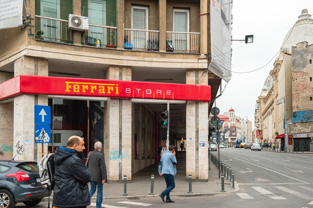 BUCHAREST, ROMANIA - NOV 1, 2015: Ferarri luxury store in central Bucharest with pedestrians walking buyのeditorial素材