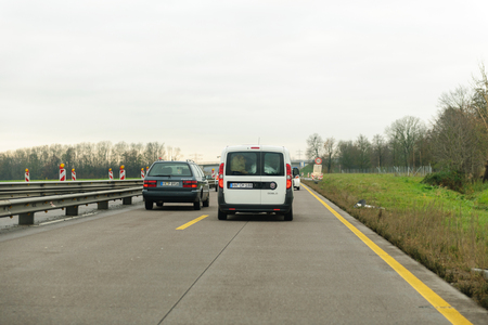 COLOGNE, GERMANY - NOV 30, 2013: Driver point of view of cars driving in front off him on German autobahn on a rainy dayのeditorial素材