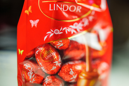 KILCHBERG, SWITZERLAND - MAR 20, 2014: Tasty Lindt Lindor chocolate in box ready for Christmas holidays. Lindt AG, more commonly known as Lindt, is a Swiss chocolatier and confectionery company founded in 1845 and known for their chocolate truffle balls aのeditorial素材
