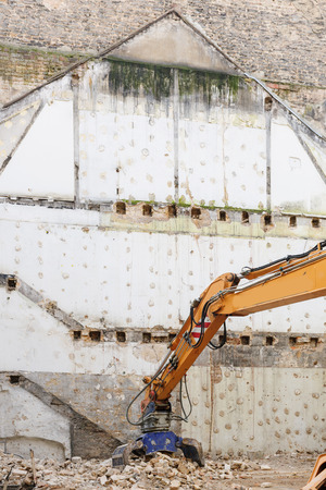 Hydraulic crusher excavator machine detail at site demolition of an oldd buildingの写真素材