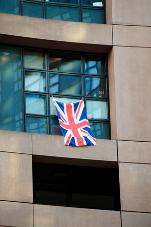 United Kingdom of Great Britain and Northern Ireland or Union Jack flag attached to a parliamentarian window at the European Parliamentの写真素材