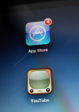 FRANKFURT, GERMANY - SEP 22, 2012: First Apple iPad Retina tablet screen detail with Mail app and You Tube app taken with tilt-shift lensのeditorial素材