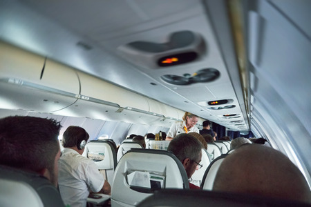 GERMANY - JUN 7, 2015: Lufthansa Airlines  plane full with passengers with smiling stewardess serving travelersのeditorial素材