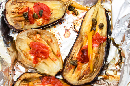 Delicious home made eggplant aubergine coocked in owen with mix of tomato, capers, onions and cheeseの写真素材
