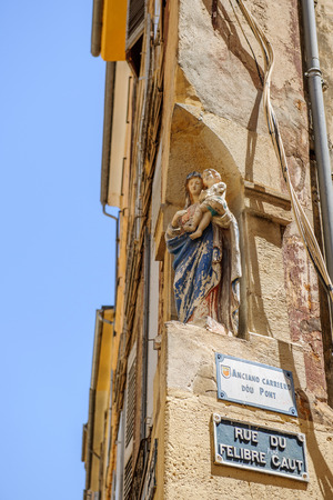 Rue du Felibre Caut street with vinntage Santa Maria statue on its corner in the center of Aix-En-Provence on a warm summer dayの写真素材