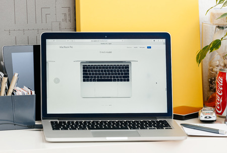 PARIS, FRANCE - OCT 28 2016: Apple Computers website on new MacBook Pro Retina without OLED touch bar in a geek creative room showcasing new professional laptop - 13 inch model with touch bar seen from aboveのeditorial素材
