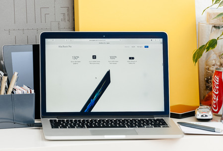 PARIS, FRANCE - OCT 28 2016: Apple Computers website on new MacBook Pro Retina with OLED touch bar in a geek creative room showcasing new professional laptop - detail of the new computer specsのeditorial素材