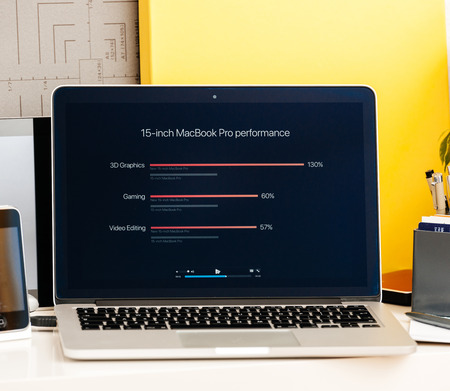 PARIS, FRANCE - OCT 28 2016: Apple Computers website on new MacBook Pro Retina with OLED Touch bar in geek creative room showcasing Apple Keynote presentation of laptop performance, CPU GPU and Thunderbolt 3 portsのeditorial素材