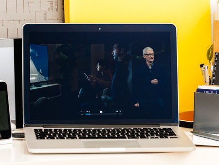 PARIS, FRANCE - OCT 28 2016: Apple Computers website on new MacBook Pro Retina with OLED Touch bar in geek creative room showcasing Apple Keynote , Tim cook talking about the future of Apple TVのeditorial素材