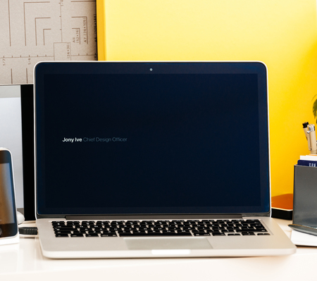 PARIS, FRANCE - OCT 28 2016: Apple Computers website on new MacBook Pro Retina with OLED Touch bar in geek creative room showcasing Apple Keynote presentation of Jhony Ive presenting the new laptop filmのeditorial素材