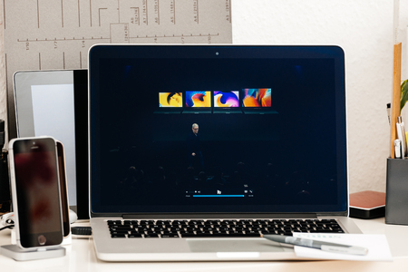 PARIS, FRANCE - OCT 28 2016: Apple Computers website on new MacBook Pro Retina with OLED Touch bar in geek creative room showcasing Apple Keynote presentation of laptop range by Tim Cookのeditorial素材