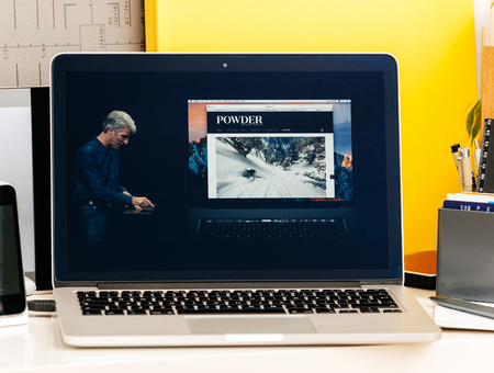 PARIS, FRANCE - OCT 28 2016: Apple Computers website on new MacBook Pro Retina with OLED Touch bar in geek creative room showcasing Apple Keynote presentation Craig Federighi talking about new MacBook Proのeditorial素材