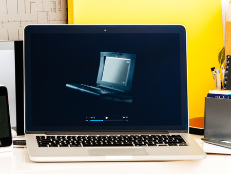 PARIS, FRANCE - OCT 28 2016: Apple Computers website on new MacBook Pro Retina with OLED Touch bar in geek creative room showcasing Apple Keynote presentation all MacBook pro, PowerBook and iBook laptops historyのeditorial素材
