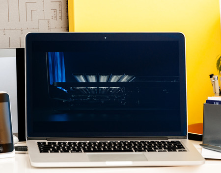 PARIS, FRANCE - OCT 28 2016: Apple Computers website on new MacBook Pro Retina with OLED Touch bar in geek creative room showcasing Apple Keynote presentation of Jhony Ive presenting the new laptop filmのeditorial素材