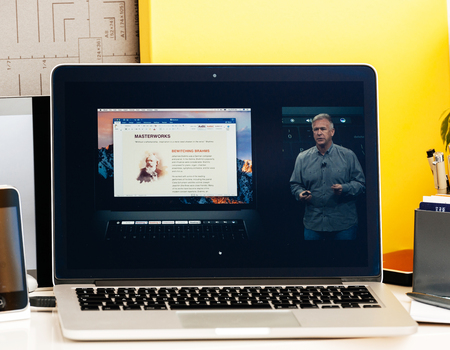 PARIS, FRANCE - OCT 28 2016: Apple Computers website on new MacBook Pro Retina with OLED Touch bar in geek creative room showcasing Apple Keynote presentation of Philip Schiller inegration softwareのeditorial素材