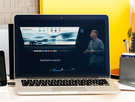 PARIS, FRANCE - OCT 28 2016: Apple Computers website on new MacBook Pro Retina with OLED Touch bar in geek creative room showcasing Apple Keynote - Philip Schiller talking about new speccs, Touch Id, Oled Barのeditorial素材