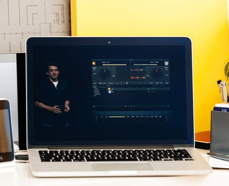 PARIS, FRANCE - OCT 28 2016: Apple Computers website on new MacBook Pro Retina with OLED Touch bar in geek creative room showcasing Apple Keynote presentation of DJ capabilities of the new OLED barのeditorial素材