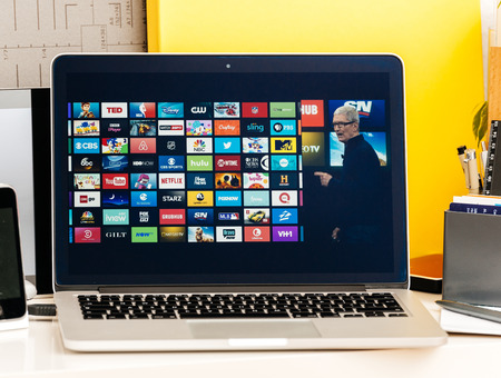 PARIS, FRANCE - OCT 28 2016: Apple Computers website on new MacBook Pro Retina with OLED Touch bar in geek creative room showcasing Apple Keynote , Tim cook talking about the future of Apple TVのeditorial素材