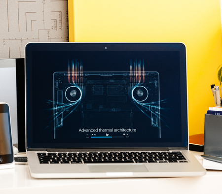 PARIS, FRANCE - OCT 28 2016: Apple Computers website on new MacBook Pro Retina with OLED Touch bar in geek creative room showcasing Apple Keynote presentation of advanced therm architectureのeditorial素材