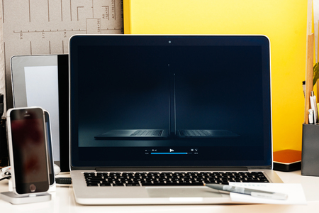 PARIS, FRANCE - OCT 28 2016: Apple Computers website on new MacBook Pro Retina with OLED Touch bar in geek creative room showcasing Apple Keynote presentation of both new MacBook Proのeditorial素材