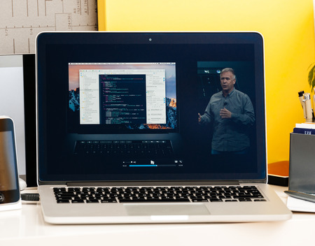 PARIS, FRANCE - OCT 28 2016: Apple Computers website on new MacBook Pro Retina with OLED Touch bar in geek creative room showcasing Apple Keynote presentation of philip Schiller talking about oled bar integrationのeditorial素材