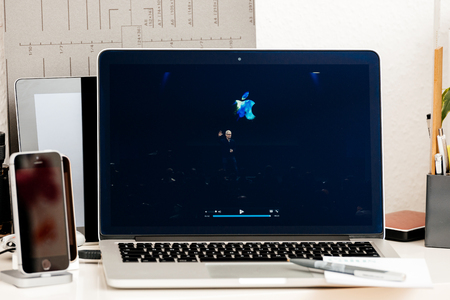 PARIS, FRANCE - OCT 28 2016: Apple Computers website on new MacBook Pro Retina with OLED Touch bar in geek creative room showcasing Apple Keynote Tim Cook thanking for the eventのeditorial素材