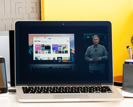 PARIS, FRANCE - OCT 28 2016: Apple Computers website on new MacBook Pro Retina with OLED Touch bar in geek creative room showcasing Apple Keynote presentation of philip Schiller talking about oled bar integrationのeditorial素材