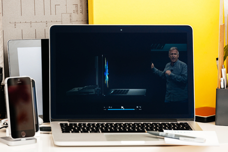 PARIS, FRANCE - OCT 28 2016: Apple Computers website on new MacBook Pro Retina with OLED Touch bar in geek creative room showcasing Apple Keynote presentation of Philip Schiller Presentation of the new specsのeditorial素材