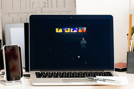 PARIS, FRANCE - OCT 28 2016: Apple Computers website on new MacBook Pro Retina with OLED Touch bar in geek creative room showcasing Apple Keynote presentation of laptop range by Philip Schillerのeditorial素材
