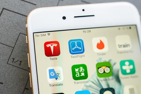 PARIS, FRANCE - SEPT 26, 2016: New iPhone 7 Plus with the plethora applications on the screen - focus on Tesla, TripAdvisor, Tinder, Viber, Word, Youtube etcのeditorial素材