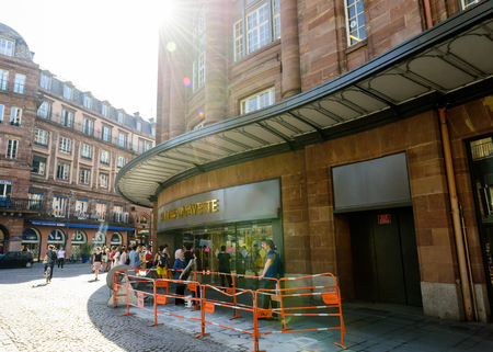 STRASBOURG, FRANCE - JUN 24, 2016: Shoppers waiting to enter the famous Galleries Lafayette in center of Strasbourg early in the morning during the start of the sale periodのeditorial素材