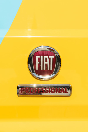 TURIN, ITALY - CIRCA 2016: Fiat Professional sign on the yellow delivery van - light commercial vehicle. Fiat Professional is the brand name and subsidiary for FCA Italy's (formerly Fiat Group Automobiles) light commercial vehicles and their passenger varのeditorial素材