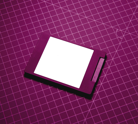 Modern fast SSD Solid State Drive on purple technological background. Sata 6 gb connection perfect for RAID, Thunderbolt 3 storageの写真素材