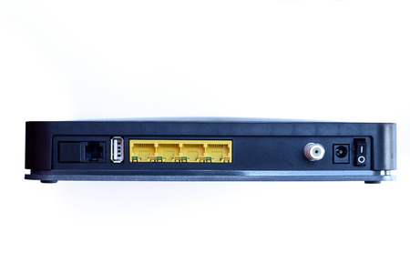 ADSL modem with four yellow LAN ports, one USB port and one coaxial antenna plug, power switch on/off, and ac/dc power adapter plug. Asymmetric digital subscriber lineの写真素材