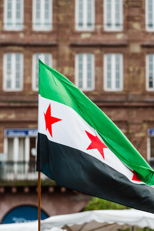 Flag of Syria in urban environemnt at protestの写真素材