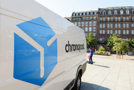 STRASBOURG, FRANCE - JUN 24, 2016: CHRONOPOST delivery van in center of the city vith classical...