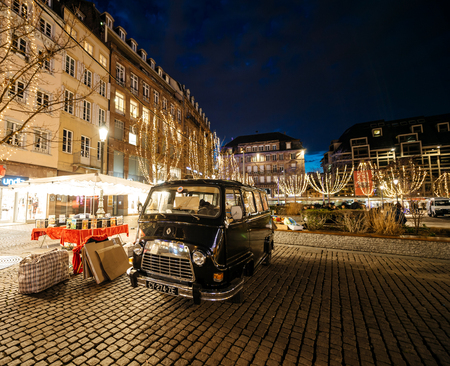 STRASBOURG, FRANCE - DEC 24, 2015: Old Renault van selling old books with Christmas Market decorations in French city of Strasbourg, Place Kleberのeditorial素材