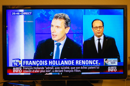 PARIS, FRANCE - DEC 1, 2016: Journalist debates as Francois Hollande at French Television address to the Nation that he will not seek re-election as president of Franceのeditorial素材