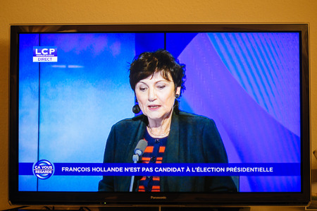 PARIS, FRANCE - DEC 1, 2016: Journalist debates as Francois Hollande at French Television address to the Nation that he will not seek re-election as president of Franceのeditorial素材