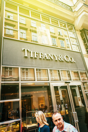 VIENNA, AUSTRIA - JULY 05, 2011: Tiffany & Company store facade with customers and pedestrians peassing nearby on a sunny dayのeditorial素材