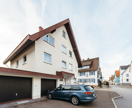 FREUDENSTADT, GERMANY - NOV 20, 2016: Hybrid Volkswagen Passat wagon car  parked on the German street with german architecture in the backgroundのeditorial素材