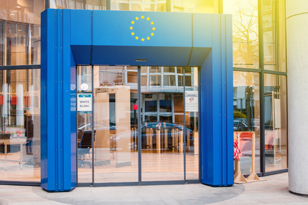 STRASBOURG, FRANCE - MARCH 24, 2015: Official delegation entrance to Council of Europe European Union with blue gate and European Union Stars logo above and white security code badge on the door.のeditorial素材